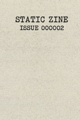 A glitch-textured zine cover with the title “STATIC ZINE” and the subtitle “ISSUE 000002” printed in bold, distressed typewriter font on a speckled, off-white background with faint digital noise lines.